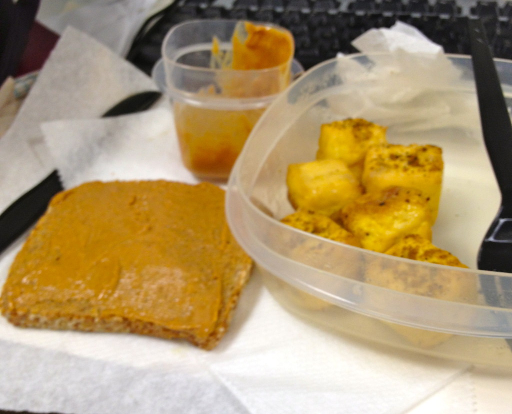 4 ounces of baked tofu sprinkled with curry powder and pepper, 1 piece of ezekiel toast with 1 Tablespoon of creamy natural peanut butter 